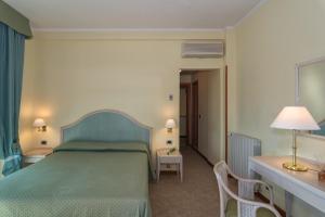 Postel nebo postele na pokoji v ubytování Hotel Siesta