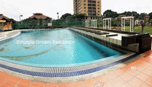 The swimming pool at or close to AFamosa Purple Dream Residence Condotel homestay