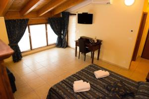 TV a/nebo společenská místnost v ubytování B&B Le Murette - ENJOY HOLIDAY