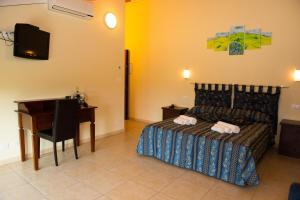 Postel nebo postele na pokoji v ubytování B&B Le Murette - ENJOY HOLIDAY + 22 fotografií
