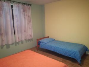 En eller flere senge i et værelse på Apartment Nela