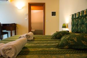 Postel nebo postele na pokoji v ubytování B&B Le Murette - ENJOY HOLIDAY