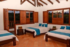 Un pat sau paturi într-o cameră la Hotel Estorake San Agustin Huila