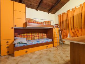 a room with two bunk beds in a room at Villa Giovanna in Arenella