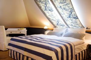 Ein Bett oder Betten in einem Zimmer der Unterkunft Pension La Casa dei Colori