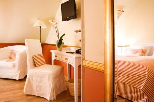 Postel nebo postele na pokoji v ubytování Pension La Casa dei Colori