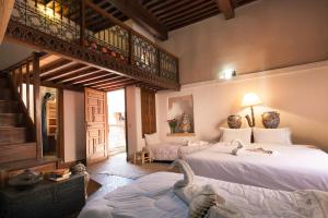 Postel nebo postele na pokoji v ubytování Riad Zanzibar