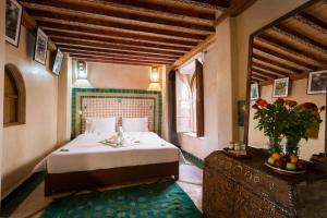 Postel nebo postele na pokoji v ubytování Riad Zanzibar