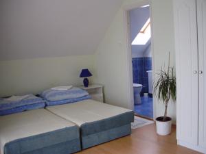 Postel nebo postele na pokoji v ubytování Campari Panzió