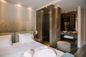 Llit o llits en una habitació de Casa do Rio charm suites
