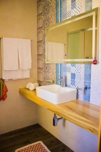 a bathroom with a white sink and a mirror at Angels' Place Aria in Nadur