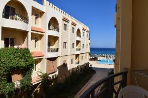 a view from the balcony of a building at Palm Beach Piazza Apart hotel Sahl Hasheesh in Hurghada