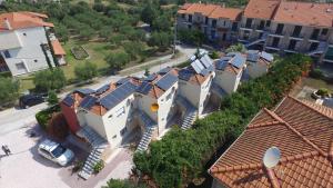 an overhead view of a house with solar panels on its roofs at Apartments Monika in Kriopigi
