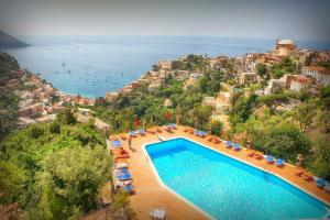 an aerial view of a swimming pool with a resort at Positano Holidays in Positano