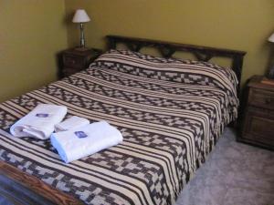 Un pat sau paturi într-o cameră la COMPLEJO DEL MIRADOR con piscina climatizada
