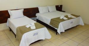 Postel nebo postele na pokoji v ubytování Hotel Monte Carlo Uberaba - Próximo ao Hospital UFTM , Hospital Dr Hélio Angotti e Hospital Regional Uberaba