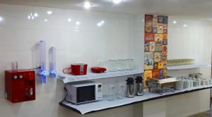 Kuchyň nebo kuchyňský kout v ubytování Hotel Monte Carlo Uberaba - Próximo ao Hospital UFTM , Hospital Dr Hélio Angotti e Hospital Regional Uberaba