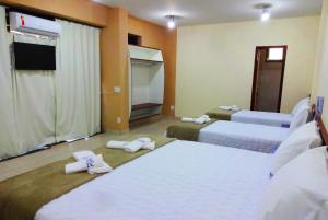 Postel nebo postele na pokoji v ubytování Hotel Monte Carlo Uberaba - Próximo ao Hospital UFTM , Hospital Dr Hélio Angotti e Hospital Regional Uberaba