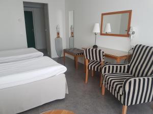 Postel nebo postele na pokoji v ubytování Guntorps Herrgård
