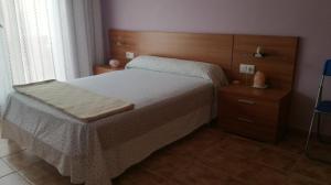 Postel nebo postele na pokoji v ubytování Casa Paxixa