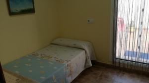 Postel nebo postele na pokoji v ubytování Casa Paxixa