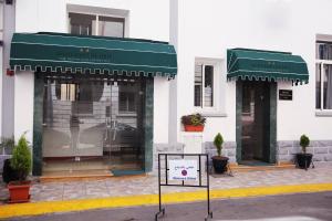 a store front with green awnings and a sign in front at Point du Jour in Casablanca