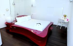 Postel nebo postele na pokoji v ubytování Absoluto Design Hotel