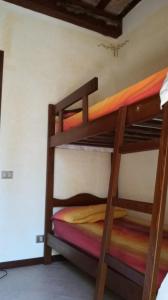 A bed or beds in a room at Casale Montemoro