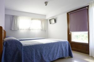 Postel nebo postele na pokoji v ubytování Casa Codesal Apartamentos