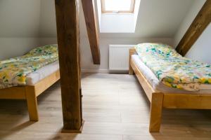 Postel nebo postele na pokoji v ubytování Mazurskie Apartamenty