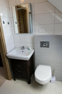 Koupelna v ubytování Mazurskie Apartamenty