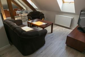 Posezení v ubytování Mazurskie Apartamenty