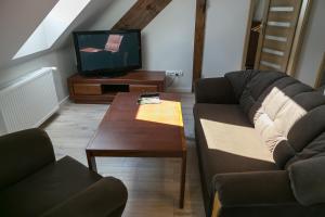Posezení v ubytování Mazurskie Apartamenty