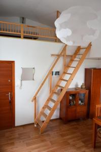 a wooden staircase in a room with a ceiling at Apartament sopot 2 pokoje in Sopot