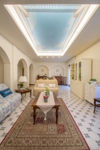 a large living room with a couch and a table at Art de vivre in Sorrento