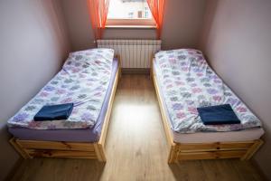 Postel nebo postele na pokoji v ubytování Mazurskie Apartamenty