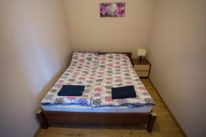 Postel nebo postele na pokoji v ubytování Mazurskie Apartamenty