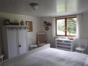 En eller flere senger på et rom på Chalet Chic