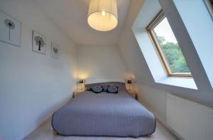 Кровать или кровати в номере Apart-Invest Apartamenent Bergen