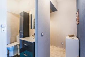 a small bathroom with a sink and a toilet at Beach Houses in Costa da Caparica +86 photos