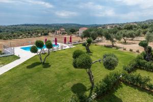 an aerial view of a garden with a swimming pool at Elaias Gi Residence in Mousata