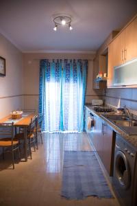 a kitchen with a table and a dining room at Your HOME, Nazaré in Nazaré +16 photos