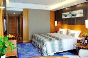 Posteľ alebo postele v izbe v ubytovaní Sentosa Hotel Apartment Taoyuan Branch