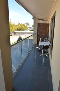 
a room with a balcony and a large window at Renmark Holiday Apartments in Renmark
