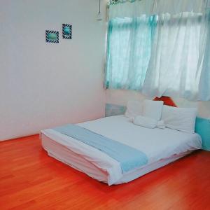 Postel nebo postele na pokoji v ubytování Pu Shi Homestay
