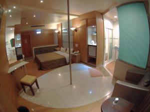 a large hotel room with a bed and a bathroom at ChangSing Business Motel in Tainan