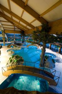an overhead view of a large swimming pool in a resort at Bohinj Eco Hotel in Bohinj