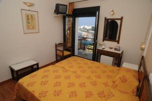 Posteľ alebo postele v izbe v ubytovaní Hotel Coronis