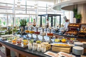 a buffet of food on a table in a restaurant at Grand Nikko Tokyo Daiba in Tokyo