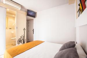 Кровать или кровати в номере Ten Hostel